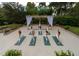 Tranquil outdoor yoga space with a pergola and lush landscaping at 36750 Us Highway 19 N # 04221, Palm Harbor, FL 34684