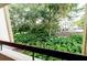 Tranquil view of a wooded area from the private balcony at 36750 Us Highway 19 N # 04221, Palm Harbor, FL 34684