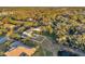 Aerial view of a waterfront property with a house and lush landscape at 3870 155Th E Ave, Parrish, FL 34219