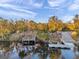 Aerial view of waterfront home with private dock and lush landscaping at 3870 155Th E Ave, Parrish, FL 34219