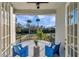 Balcony with two chairs and a view of the backyard at 3870 155Th E Ave, Parrish, FL 34219