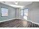 Simple bedroom with neutral walls and dark wood flooring at 3870 155Th E Ave, Parrish, FL 34219