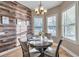 Bright breakfast nook with wood-look wall and view of the backyard at 3870 155Th E Ave, Parrish, FL 34219