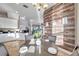 Kitchen breakfast nook with table and chairs, featuring wood-look wall at 3870 155Th E Ave, Parrish, FL 34219