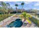 Inviting kidney-shaped pool surrounded by a spacious patio at 3870 155Th E Ave, Parrish, FL 34219