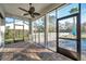 Relaxing screened porch with tile floor and ceiling fan at 3870 155Th E Ave, Parrish, FL 34219