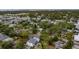 Aerial view of a house nestled in a tree-lined neighborhood, close to the water at 4224 W Kensington Ave, Tampa, FL 33629