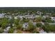 Aerial view showcasing a home's location in a residential area with mature trees at 4224 W Kensington Ave, Tampa, FL 33629