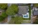 Aerial view of a house with a pool in a lush, residential neighborhood at 4224 W Kensington Ave, Tampa, FL 33629