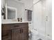 Modern bathroom with dark vanity and walk-in shower at 4224 W Kensington Ave, Tampa, FL 33629