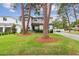 Two-story house with light gray siding, landscaping, and a paved driveway at 4224 W Kensington Ave, Tampa, FL 33629