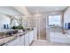 Elegant bathroom with granite countertops, a soaking tub, and a walk-in shower at 4327 Pullet Ct, Lakewood Ranch, FL 34211