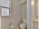 Small half bathroom with toilet and pedestal sink at 4333 Trails Dr # 10-1, Sarasota, FL 34232