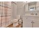 Clean bathroom with shower/tub combo, white vanity, and striped shower curtain at 4333 Trails Dr # 10-1, Sarasota, FL 34232