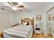 Comfortable bedroom with ceiling fan and wood floors at 4333 Trails Dr # 10-1, Sarasota, FL 34232