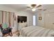 Well-lit bedroom with a ceiling fan and flat-screen TV at 4333 Trails Dr # 10-1, Sarasota, FL 34232