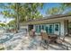 Community deck with tables and chairs near pool at 4333 Trails Dr # 10-1, Sarasota, FL 34232