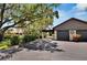 Two-car garage with covered carport and lush landscaping at 4333 Trails Dr # 10-1, Sarasota, FL 34232