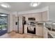 Updated kitchen featuring granite countertops and stainless steel appliances at 4333 Trails Dr # 10-1, Sarasota, FL 34232