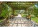 Relaxing pergola with benches and brick pathway at 4333 Trails Dr # 10-1, Sarasota, FL 34232