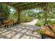 Peaceful pergola with benches shaded by lush greenery at 4333 Trails Dr # 10-1, Sarasota, FL 34232