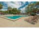 Inviting community pool with lounge chairs for relaxing at 4333 Trails Dr # 10-1, Sarasota, FL 34232