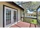 Screened porch with wood deck and access to backyard at 4333 Trails Dr # 10-1, Sarasota, FL 34232