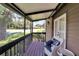 Relaxing screened porch with wicker chairs and tranquil views at 4333 Trails Dr # 10-1, Sarasota, FL 34232