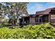 Spacious screened porch with wood deck, offering a relaxing outdoor space at 4333 Trails Dr # 10-1, Sarasota, FL 34232