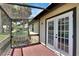 Screened porch with French doors and a view of the community at 4333 Trails Dr # 10-1, Sarasota, FL 34232