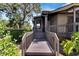 Wooden walkway to home entrance with landscaping at 4333 Trails Dr # 10-1, Sarasota, FL 34232