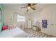 Bright bedroom with a twin bed, dresser, and desk at 4702 W Bay Ave, Tampa, FL 33616