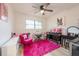 Stylish bedroom featuring a vanity and pink rug at 4702 W Bay Ave, Tampa, FL 33616