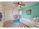 Charming bedroom with twin bed and built-in closet at 4702 W Bay Ave, Tampa, FL 33616