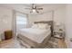 Main bedroom with plush bed, nightstands, and ceiling fan at 4702 W Bay Ave, Tampa, FL 33616