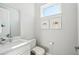 Clean and modern half bathroom with white vanity at 4722 Legacy Park Dr, Tampa, FL 33611