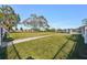 Fenced dog park with grassy area and trees at 4722 Legacy Park Dr, Tampa, FL 33611