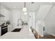 White kitchen with quartz countertops and a built-in pantry at 4722 Legacy Park Dr, Tampa, FL 33611