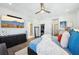 Main bedroom with king bed, walk-in closet, and hardwood floors at 4722 Legacy Park Dr, Tampa, FL 33611