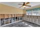 Bedroom featuring a ceiling fan, window with curtains, and unfinished walls at 4801 Venetian Ne Pl, St Petersburg, FL 33703