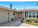 Close-up of a home's entrance with a brick pathway, well-kept garden, and inviting front door, showcasing curb appeal at 4801 Venetian Ne Pl, St Petersburg, FL 33703