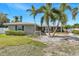 Charming single-story home featuring well-kept landscaping, a brick facade, and inviting curb appeal at 4801 Venetian Ne Pl, St Petersburg, FL 33703