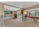 Living room with fireplace and sliding glass doors to the outside at 4801 Venetian Ne Pl, St Petersburg, FL 33703