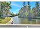 Beautiful view of the waterfront showcasing the lush landscaping and private docks of the neighborhood at 4801 Venetian Ne Pl, St Petersburg, FL 33703