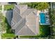 Bird's eye view of house, pool, and lush landscaping at 5020 W Dickens Ave, Tampa, FL 33629