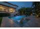 Relaxing pool with built in seating at dusk at 5020 W Dickens Ave, Tampa, FL 33629