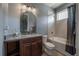 Elegant bathroom with dark wood vanity, granite countertop, and a soaking tub at 5020 W Dickens Ave, Tampa, FL 33629