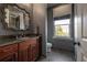 Bathroom with granite vanity and large ornate mirror at 5020 W Dickens Ave, Tampa, FL 33629