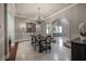 Elegant dining room features a dark wood table and chandelier at 5020 W Dickens Ave, Tampa, FL 33629