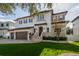 Two-story house with a three-car garage and manicured lawn at 5020 W Dickens Ave, Tampa, FL 33629